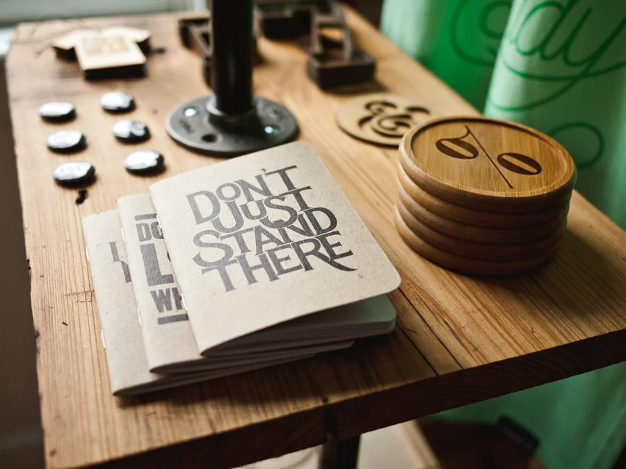 Desk with notepad and coasters