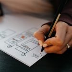Lady designing wireframes for a custom mobile application